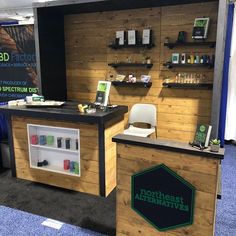 an exhibit booth with shelves, chairs and other items