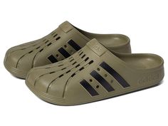 adidas Adilette Clog - Shoes : Focus Olive/Black/Focus Olive : For a casual, cool vibe, head to your work out in the comfy adidas Adilette Clog. Based on the iconic adidas slide, these sport-inspired clogs have a soft feel and are both functional and comfortable featuring a contoured EVA footbed. Sport-inspired clogs with a soft feel. Slip-on construction. Contoured EVA footbed. Regular fit. Upper, lining, insole, and outsole made of synthetic material. Imported. Measurements: Weight: 5 oz Produ Sporty Slip-resistant Clogs For Outdoor Activities, Sporty Synthetic Slip-on Clogs, Adidas Sports Slides With Rubber Sole, Adidas Sporty Slides With Rubber Sole, Spring Sports Clogs With Synthetic Material, Non-slip Sports Clogs For Spring, Casual Adidas Slides For Sports, Spring Sports Synthetic Clogs, Synthetic Clogs For Spring Sports