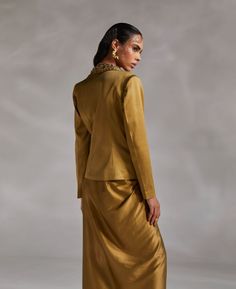 Editor's Note Featuring a solid lapel jacket with hand embroidery detailing Note: Blouse and skirt worn by model is for styling purposes only. Color: Olive green Fabric: Heavy Satin Fit type: Tailored Components: Jacket Occasion: Party Care: Dry Clean Only About the Designer The crux and essence of the label, Divya Aggarwal, is to challenge and revamp the face of ordinary traditional wear while being customer oriented. Driven by the values of individuality and creativity, this contemporary India Divya Aggarwal, Olive Green Fabric, Blouse Yoke, Personal Shopping Service, Embroidery Detailing, Lapel Jacket, Traditional Wear, Modern Vibe, Embroidered Jacket