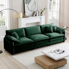 a living room with a green couch and coffee table