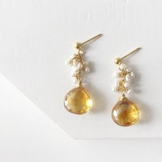 Cluster Citrine Earrings / Wire Wrapped Citrine and Pearls/ Dangle Ethnic Jewelry / Gold Tear Drop Bohemian Earrings / Gemstone EarringsThe earrings was crafted beautifully with citrine and pearls to match the tone. The details are sophisticated and wrapped with gold filled wire to make the piece lasts a long time. This stunning earrings are the must have addition to any jewelry box ♥Wire                         : Gold FilledLength of earrings: 1.80 inchesStone                       : Citrine an Gold Bohemian Earrings With Gemstone Accents, Citrine Dangle Earrings With Ear Wire, Citrine Dangle Earrings For Pierced Ears, Citrine Drop Earrings For Wedding, Amber Dangle Earrings With Natural Stones, Handmade Citrine Dangle Earrings, Citrine Earrings With Gemstone Accents As Gift, Handmade Dangle Citrine Earrings, Gold Dangle Crystal Earrings With Gemstone Accents