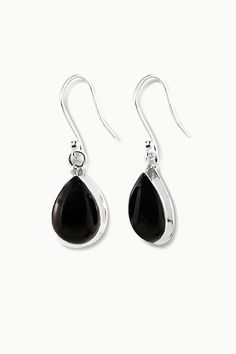 Bliss is an elegant pair of light-weight drop earrings perfect for everyday wear. Featuring high quality natural pear-cut black onyx gemstones, nestled elegantly in a fine sterling silver frame, our Bliss earrings will leave you radiating with inner joy all day long. Authentic Sivalya Black Onyx Black Onyx: Endurance, Perseverance, Grounding Hallmarked Metal: 925 Sterling Silver Gemstone Size: 15mm x 10mm Cut: Pear Cut Smooth Cabochons Black Sterling Silver Long Drop Jewelry, Black Teardrop Gemstone Earrings, Classic Sterling Silver Earrings With Black Enamel, Classic Black Enamel Sterling Silver Earrings, Elegant Black Drop Jewelry, Teardrop Onyx Gemstone Jewelry, Elegant Onyx Drop Jewelry, Black Teardrop Sterling Silver Earrings, Black Sterling Silver Teardrop Earrings