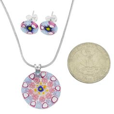 This trendy yet classic Murano Millefiori Pendant and Earrings Set turns any woman into a queen with its bright colors, unique flower patterns, and festive look. With their unique heritage rooted in Venetian history and Murano artisan tradition, Murano glass masters crafted this set using the ancient Millefiori technique. The colorful mosaic design made of tiny pieces of glass fused together in a special furnace is a rare and unique reflection of the beauty of Venice. Measurements: The Murano Gl Murano Jewelry, Murano Glass Earrings, Colorful Mosaic, Murano Glass Necklaces, Earrings Sets, Murano Glass Jewelry, Mosaic Design, Unique Flower, Necklace And Earrings Set