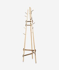 a tall wooden rack with multiple hooks on it's sides and two legs that are attached to each other