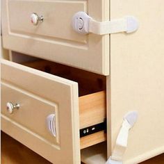 an open drawer with two white handles on it