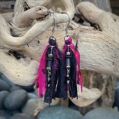 "These beautiful boho inspired earrings are hand-crafted using recycled sari silk and a variety of glass and seed beads.  They are very lightweight and the perfect addition for a casual day or fun night on the town Materials: Sari Silk/Glass Beads/Nickel Free Earwire Color: Black/Fuchsia Measurements: Drop length approx. 2 3/4\"/Tassel 2\" Weight : 1 gram/.07 oz. (individual earring) Designer: Norma Patridis *Each set of earrings comes boxed ready for gifting* Please note that color may slightly Bohemian Pink Beaded Earrings For Festive Occasions, Pink Bohemian Beaded Earrings For Festive Occasions, Festive Bohemian Pink Beaded Earrings, Bohemian Beaded Earrings With Latkans For Beach, Bohemian Beaded Earrings With Latkans For Parties, Bohemian Beaded Latkans Earrings For Beach, Bohemian Beaded Latkan Earrings For Beach, Bohemian Beaded Earrings With Latkans For Summer, Handmade Adjustable Tassel Earrings For Festival