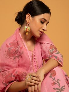 Set of 3 consists of kurta, pants, and dupatta. Reviving the age-old technique of hand block printed florals in red and green set on a majestic bed of pink soft handwoven cotton. Kurta: Delicately gathered kurta with ghera adorned in hand block printed flowers, 3/4th sleeves, and gold gota detailing on the hemline & sleeves, set in pure cotton Dupatta: Handwoven kota doria dupatta, complete with customized block prints Pants: Pink straight-fit pants in soft cotton Fit: Fitted at bust and waist. Kurta Pants, Printed Flowers, Straight Fit Pants, Cotton Dupatta, Kurta With Pants, Kurta Designs, Kurta Set, Best Face Products, Printed Pants