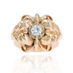 Ring in 18 karat rose gold, eagle head hallmark. Large and domed, this antique ring is adorned on top with a modern brilliant-cut diamond held in a claw. The dome of this retro ring is decorated with arabesques, gold pearls and plant motifs on the start of the ring. Diamond weight : 0.28 carat approximately. Height : 15.4 mm, width : 16.8 mm approximately, thickness : 9.4 mm approximately, width of the ring at the base : 3.3 mm approximately. Total weight of the jewel : 8 g approximately. US Siz Gold Dome Ring, Gold Baroque, Gold Eagle, Retro Ring, Big Diamond, Antique Ring, Dome Ring, Decoration Originale, Eagle Head