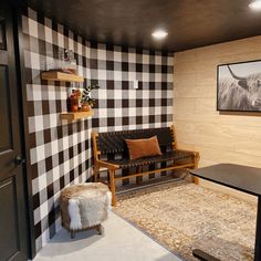 a living room with black and white checkered walls