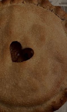 a pie with a heart shaped hole in the middle