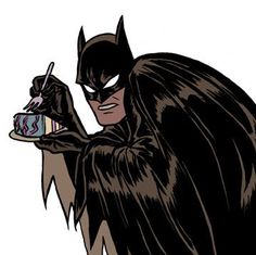 a batman holding a cake with candles on it