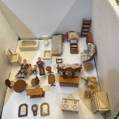 a doll house with furniture and accessories on the floor