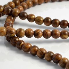 Clarity Necklace | Lucleon | 365 day return policy Simple Beaded Necklace, Simple Beaded Necklaces, Pear Wood, Universal Gift, Square Rings, Beard Care, Knot Necklace, Wooden Beads, Long Necklace