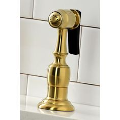 an old fashioned brass telephone on a white tile wall