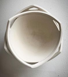 a white bowl sitting on top of a table