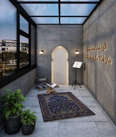 a room with a large rug and lights on the wall, next to potted plants