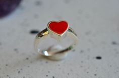 Sterling silver enamel heart ring inlay with red color enamel.  The vibrant red enamel ring.  Silver 925 enamel heart ring best for a gift for your best friend, sister or mom.  Lover ring, Valentine ring, Gift for her Material       :   Sterling silver Dimension  :   heart 8 x 8 mm The ring comes in gift box ready for a gift. Please give your phone no. for courier service. Please read our policies for information on international shipping, returns and exchanges. If you need any additional help or have any questions at all please feel free to convo me. Thanks for visiting us & Have a nice day!! Valentine's Day Red Heart Sterling Silver Ring, Red Heart-shaped Sterling Silver Rings, Red Sterling Silver Heart-shaped Rings, Heart-shaped Red Sterling Silver Rings, Red Sterling Silver Heart Ring As Gift, Anniversary Sterling Silver Red Heart Ring, Anniversary Red Heart Sterling Silver Ring, Enamel Heart Shaped Promise Ring, Heart-shaped Enamel Ring For Anniversary