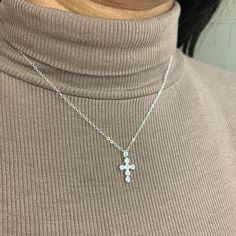 "This beautiful dainty sterling silver cross necklace is  on a sterling silver chain, with Cubic Zirconia stones on the cross.  This beautiful piece is perfect for any occasion and also makes a great gift. This piece is perfect by itself or for layering with other pieces.  Description: Material: Sterling Silver Pendant Size: 17.5mm x 9.4mm All components are made of Sterling Silver Pictured is necklace in 16\" length. See similar items below: https://www.etsy.com/ca/shop/MylasShoppe?ref=seller-platform-mcnav&section_id=28089262 For shipping details / gift box option, please see FAQs section or feel free to contact me with any questions :) Thank you for visiting!" Silver Cubic Zirconia Crucifix Necklace, Dainty Cubic Zirconia Cross Necklace, Dainty Cross Necklace In Cubic Zirconia, Sterling Silver Cross Charm Necklace With Adjustable Chain, Sterling Silver Cross Necklace With Clavicle Chain, Sterling Silver Crucifix Cross Necklace With Adjustable Chain, Sterling Silver Hypoallergenic Cross Pendant Necklace, Hypoallergenic Sterling Silver Cross Pendant Necklace, Gold Coin Choker