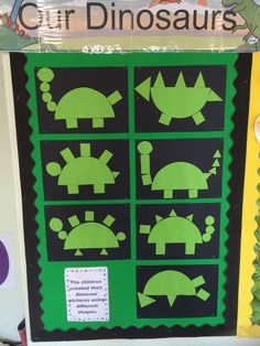 a green and black bulletin board with cut out animals