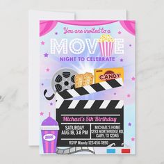 a movie birthday party card with popcorn, film clapper and soda on it's side