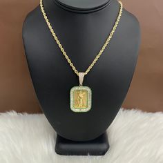 This product is avalilable to pick up in our Doral store.Features:Karat: 10K Gold.Color: Yellow Gold.Weight: 11gr "Price is only for pendant, chain is not included" Diamond Pendant With Rope Chain, Gold Diamond Necklace With Rectangular Pendant Accents, Diamond Pendant With Box Chain, Yellow Gold Diamond Rectangular Pendant Jewelry, Cubic Zirconia Pendant With Box Chain, Yellow Gold Diamond Pendant Jewelry, White Diamond Jewelry With Rope Chain, Cubic Zirconia Pendant Necklace With Box Chain, White Cubic Zirconia Jewelry With Box Chain