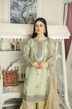 ➤ Mint green embroidered masuri organza kameez, golden jamawar Gharara, golden masuri organza dupatta | Length – Shirt Length 38"; Sharara Length 39.5" with Soft Elastic Belt; Dupatta length 2.18 m Width With Lace 0.89 m & Without Lace 0.85 m ➤ ➤ ➤ ➤ 🌸 Fabric Details - Chiffon, Organza, 🌸 Craft and Decorations - Beautiful Embroideries, embellishments, patches, and laces 🌸 Care - Hand Wash only 🌸 Length & Style - Top ~ 38 - 40 " A-Line/ kurta style, bottom trousers/gharara style, with embroid Party Sharara With Resham Embroidery In Jamawar, Elegant Jamawar Sharara For Party, Eid Tissue Silk Dress With Dabka Details, Gold Organza Lawn Suit With Dabka Work, Eid Tissue Silk Dress With Dabka, Gold Unstitched Suit For Eid, Festive Party Lawn Suit In Raw Silk, Festive Organza Salwar Kameez For Eid, Gold Anarkali Salwar Kameez In Organza