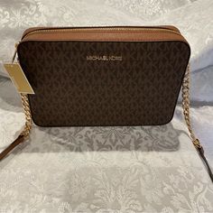 Micheal Kors Purse The Size Is 9.5 Long X 2 Inches Wide X 9.5 Tall This Purse Has An Adjustable Leather And Gold Chain Strap That Will Adjust From 28.5 From Shoulder To Bottom Of Chain And As Short As 22.5 From Shoulder. This Purse Is Brand New In Excellent Condition. This Purse Is A Light Brown Wiyh A Darker Brown Front And Back The Purses Strap In Pictures Is At The Shortest Length. The Price Of This Purse Is $150.00 Thank You For Shopping With Us. Michael Kors Rectangular Shoulder Bag With Zipper Closure, Michael Kors Rectangular Shoulder Bag With Zipper, Michael Kors Tan Rectangular Bag, Michael Kors Rectangular Bag With Zipper Closure, Michael Kors Tan Bag With Gold-tone Hardware, Michael Kors Tan Bag With Adjustable Strap, Michael Kors Tan Crossbody Bag, Michael Kors Handbags Crossbody, Cheetah Bag