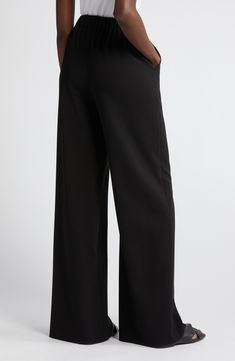 Refresh your work wardrobe with streamlined, full-length wide-leg pants made from stretch-woven fabric for comfort wherever the day takes you. Zip fly with hook-and-bar closure Side-seam pockets 62% polyester, 33% viscose, 5% spandex Dry clean Imported Formal Wide-leg Pants With 4-way Stretch, Elastane Wide Leg Pants For Work, Stretch Wide Leg Workwear Pants, Wide-leg Elastane Dress Pants With Pockets, Business Stretch Wide Leg Dress Pants, Sleek Wide Leg Workwear Pants Full Length, Sleek Wide Leg Workwear Pants, Wide Leg Stretch Dress Pants For Business, Stretch Wide Leg Dress Pants For Business