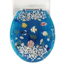 a blue toilet seat with fish and shells on it