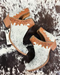 Note: Genuine cowhide used. Variations in spots and color are natural. Each pair is unique. Embrace the authenticity. These beautiful boots will make you look simply stunning! Gorgeous hair-on hide is embraced by timeless hand-tooled leather in a golden honey tone. They include our split-side design and tapered heels for the perfect look. They'll be a sure favorite! Western Brown Calf Hair Boots, Brown Calf Hair Boots With Leather Sole, White Calf Hair Boots For Fall, Western Shoes, Wedding Boots, Hand Tooled Leather, Beautiful Boots, Cowgirl Outfits, Boot Shoes Women