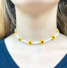 This beautiful Sunflower necklace is inspired by Harry Styles' song Sunflower vol. 6! I absolutely love the cute yellow sunflowers around the necklace. Similar to my other sunflower necklaces, this necklace is 14 inches long and has a two-inch extender chain and lobster claw clasp. This necklace is a perfect accessory to wear for any season, and is sure to bring you compliments! Yellow Flower-shaped Beaded Necklaces, Yellow Flower Shaped Jewelry With Sunflower Print, Yellow Flower-shaped Jewelry With Sunflower Print, Yellow Flower-shaped Beaded Necklace, Adjustable Yellow Flower Charm Necklace, Yellow Adjustable Flower Pendant Necklace, Adjustable Yellow Flower Pendant Necklace, Yellow Flower-shaped Beaded Necklaces With Colorful Beads, Cute Yellow Round Bead Necklaces