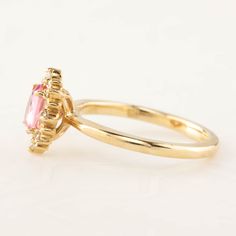 This is made to order ring. Beautiful unheated pink sapphire from Madagascar, weight ranges from 0.60 to 0.7ct, 7x5mm, eye clean 0.08ctw., G color SI clarity accent diamonds Band width: approx. 1.9mm High profile setting, easy stacking with a straight band Made of recycled solid 14k gold Our Dedication All our jewelry is designed and created by Kat with great attention to details and the entire production from casting, stone setting to finishing takes place in New York, USA. All gemstones used i Pink Sapphire Engagement Ring, Pink Sapphire Ring Engagement, Diamond Halo Engagement Ring, Pink Sapphire Ring, Sapphire Engagement Ring, Oval Ring, Oval Rings, Name Jewelry, Halo Diamond Engagement Ring