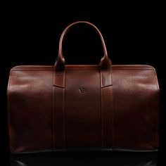 We designed the leather Weekender bag to be practical, spacious, and timelessly elegant—a woman's leather holdall that fits everything you need on weekend trip or a city break abroad. Handcrafted in Northern Italy by experienced craftsmen in family-owned studios, the Weekender is made from full-grain vegetable-tanned cow leather of exquisite quality. Smooth yet sturdy top leather handles make it easy to carry, and there's an adjustable leather shoulder strap, which you can easily remove. The spa Luxury Cognac Weekender Bag For Everyday, Timeless Textured Leather Bag For Business Trips, Classic Business Travel Bag In Textured Leather, Luxury Cognac Weekender Bag With Leather Handles, Luxury Cognac Duffle Bag For Everyday, Luxury Everyday Cognac Duffle Bag, Business Weekender Bag With Leather Handles In Cognac, Classic Business Duffle Bag With Textured Leather, Luxury Leather-lined Weekender Bag For Formal Occasions