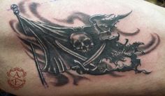 a man's arm with a skull and flag tattoo on the back of it