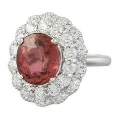 Stamped: 14K Total Ring Weight: 7.9 Grams Tourmaline Weight 5.30 Carat (11.00x9.80 Millimeters)Diamond Weight: 1.50 carat (F-G Color, VS2-SI1 Clarity )Face Measures: 20.40x17.90 Millimeter SKU: [601191] Gia Certified Tourmaline Rings For Formal Occasions, Oval Tourmaline White Gold Rings, Fine Jewelry Tourmaline Rings With Brilliant Cut, Elegant Oval Tourmaline Gemstones, Elegant Tourmaline Gemstone With Center Stone, Gia Certified Tourmaline Wedding Ring, Luxury Tourmaline Rings With Halo Setting, Wedding Gia Certified Tourmaline Ring, Formal Tourmaline Round Cut Rings