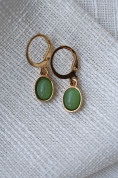 These Green Pendant Hoop Earrings include a green leaf like hue in the charms which adds a captivating touch. Color: Gold and Green. Material: Zinc Alloy. Measurements: Length: 3.0 Centimeters. Width: 1.0 Centimeters. Green Metal Clip-on Earrings For Gift, Green Metal Clip-on Earrings, Green Teardrop Clip-on Earrings, Green Metal Drop Clip-on Earrings, Trendy Green Dangle Jewelry, Trendy Green Metal Jewelry, Nickel Free Green Metal Earrings, Nickel-free Green Metal Earrings, Green Metal Hoop Earrings As A Gift