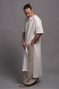 "🌿 ITEM DESCRIPTION Comfy linen tunic shirt for men. Fabric: 100% pure linen in medium weight - washed and softened. Color: Big color choice - 31 colors from the color chart (please see the pics) All SH�ĀNTIMA linen items come in a beautiful wrap, which makes them not only a lovely purchase but also a cool gift. 🌿 SIZING Petit, Regular, Plus Size - all our clothes come in sizes XS-3XL The model (5'9'', 174cm) is wearing size M. The color of this shirt is N9 - ANTIQUE WHITE Feel free to contact Long Shirt Men, Mens Linen Outfits, Long Linen Shirt, Mens Tunic, Linen Tunic Shirt, Flax Clothing, Linen Harem Pants, Linen Tunic Dress, Dress Kaftan