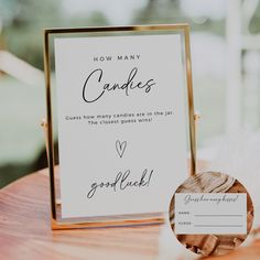 a close up of a sign on a wooden table with a card attached to it