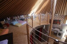 an aerial view of a living room and bedroom area in a small house with wood floors