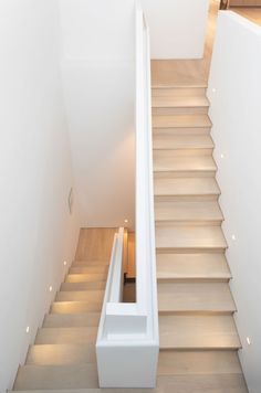 there is a stair case in the middle of this room that has light on it