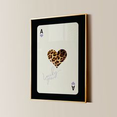 a card with a heart on it hanging on the wall