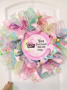 a pink and green wreath that says your first thought is too busy for anyone to use it