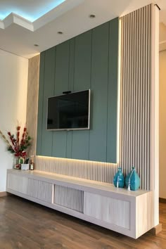 a flat screen tv mounted to the side of a wall