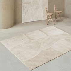 a chair and rug in an empty room