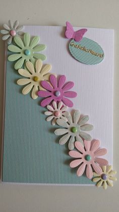 a card with flowers and a butterfly on it