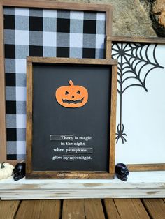 there is a blackboard with an orange pumpkin on it