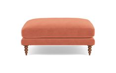 an orange ottoman with wooden legs on a white background