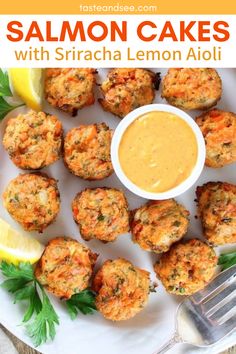 salmon cakes with sriraca lemon aioli on a white plate