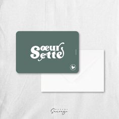 a white envelope with the words seuff serte written on it and an envelope with