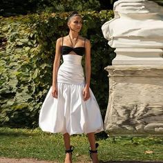 Introducing our White Satin Mermaid Skirt, a timeless and elegant piece that exudes sophistication and charm. Crafted from luxurious satin fabric, this skirt boasts a high waist and pleated detailing that adds a touch of classic refinement to your ensemble. Its tea-length design strikes the perfect balance between modesty and allure, making it ideal for a variety of occasions, from birthdays to photoshoots.With its mermaid silhouette, this skirt accentuates your curves beautifully, creating a flattering and feminine look that's sure to turn heads. The crisp white color adds an air of purity and elegance, while the high-waisted design offers both style and comfort. Whether paired with a fitted blouse for a polished look or a flowy top for a more relaxed vibe, our White Satin Mermaid Skirt i Fitted Blouse, Conceptual Fashion, Mermaid Skirt, Mermaid Silhouette, Flowy Top, Flowy Tops, Feminine Look, Tea Length, White Satin